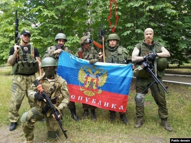 Aleksei Milchakov (second from right) with pro-Russia fighters in eastern Ukraine in 2014.